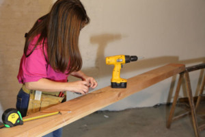 woman using cordless drill
