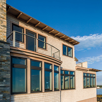 Costal building with windows and a deck